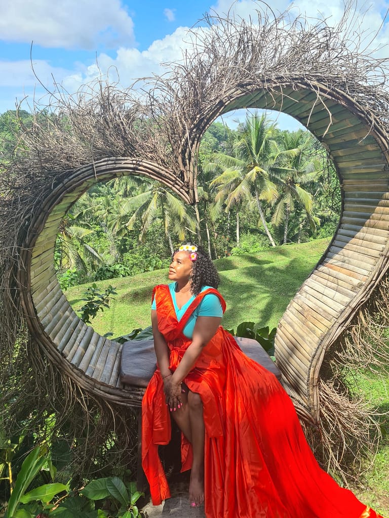 Beautiful luxury brown woman on heart shaped Bali Swing
